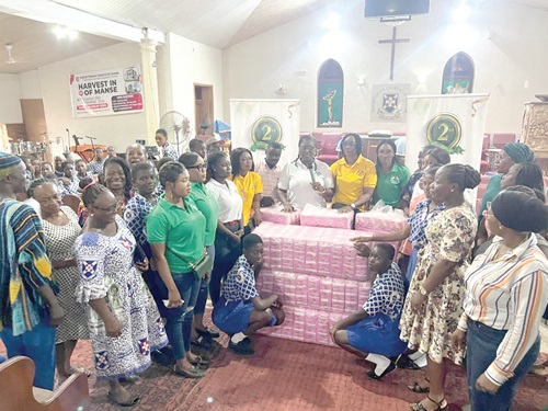 Iris Obeng-Tuudah (arrowed), President of ARB Apex Bank Ladies Association, presenting the sanitary pads to the schools. With her are some members of the association Iris Obeng-Tuudah (arrowed), President of ARB Apex Bank Ladies Association, presenting the sanitary pads to the schools. With her are some members of the association
