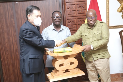 President Akufo-Addo presenting a gift to Lu Kun (left), out-going Chinese Ambassador to Ghana, at the Jubliee House. With them is Emmanuel Enos, Director of State Protocol. Picture: SAMUEL TEI ADANO President Akufo-Addo presenting a gift to Lu Kun (left), out-going Chinese Ambassador to Ghana, at the Jubliee House. With them is Emmanuel Enos, Director of State Protocol. Picture: SAMUEL TEI ADANO