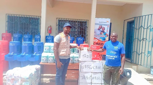 Isaiah Chentiwuni Jonah (left), acting World Vision Ghana Cluster Manager, Bawku West, presenting the items to an official of the Bawku West District Assembly