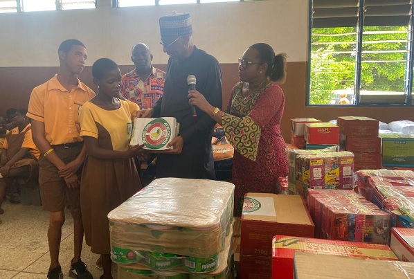 The Resident Representative of ECOWAS in Ghana, Ambassador Baba Gana Wakil (in black) presenting one of the items to the student leaders of the Dzorwulu Special School The Resident Representative of ECOWAS in Ghana, Ambassador Baba Gana Wakil (in black) presenting one of the items to the student leaders of the Dzorwulu Special School