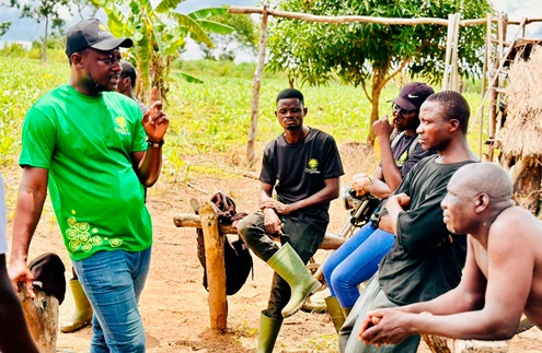 Edmond Kombat (left), CEO of Oyster Agribuinsess, interacting with some farmers