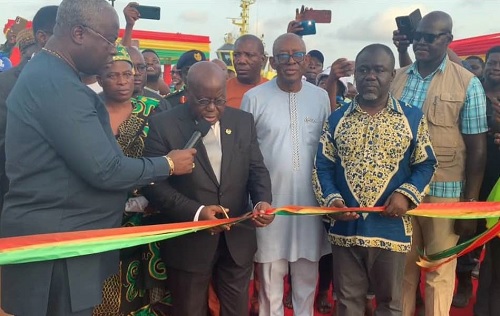 President Nana Addo Dankwa Akufo-Addo (in suit), cutting a tape to open the new facility. Those with him are Kwaku Ofori Asiamah (2nd from right), Minister of Transport, Isaac Osei (3rd from right), Board Chairman, GPHA and other dignitaries