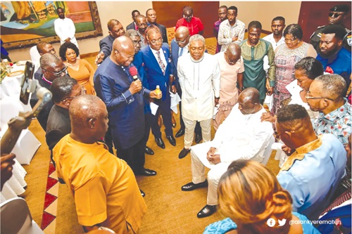Alan Kyerematen (seated) being prayed for by the clergy