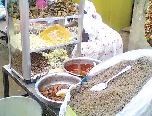 A food vendor displaying wasawasa for sale in Tamale