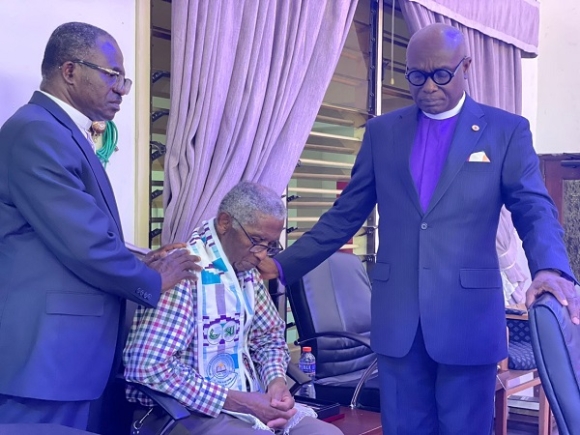 Most.Rev. Prof. J. Asamoah-Gyadu, praying for Osei-Mensah