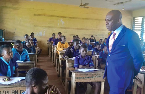 Professor Yayra Dzakadzie, Director-General of NaCCA, observing pupils at the School for the Deaf at Mampong-Akuapem during the Mathematics paper of the National Standardised Test