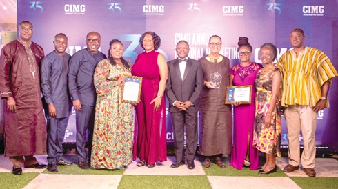 Some managers and staff of GCB Bank displaying their citations and shield Some managers and staff of GCB Bank displaying their citations and shield