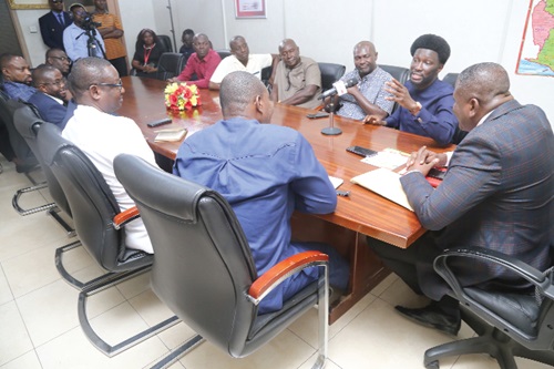 Nana Kwame Bediako (2nd from right), Leader of the Third Force Movement, explaining a point to the Editorial Conference. In the meeting includes Franklin Sowa (right), Director, Marketing and Sales. Picture: SAMUEL TEI ADANO