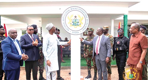 Armah-Kofi Buah (right), Minister of Lands and Natural Resources, and Muntaka Mohammed Mubarak (left), Minister for the Interior, jointly inaugurating the office. With them include Ernest Brogya Genfi (2nd from left), Deputy Minister of Defence, and Martin Ayisi, Chief Executive Officer, Minerals Commission Armah-Kofi Buah (right), Minister of Lands and Natural Resources, and Muntaka Mohammed Mubarak (left), Minister for the Interior, jointly inaugurating the office. With them include Ernest Brogya Genfi (2nd from left), Deputy Minister of Defence, and Martin Ayisi, Chief Executive Officer, Minerals Commission
