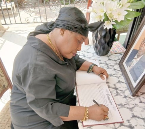 Nana Yaa Akyempim Jantuah, former Director of External Affairs, PURC, signing the book of condolence