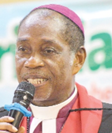  Rt Rev. Dr Samuel Nii Nmai Ollennu (inset) addressing the audience at the event. Picture: CALEB VANDERPUYE 