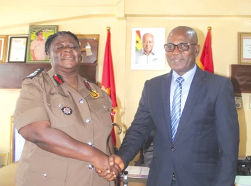 Daniella Mawusi Ntow Sarpong (left), Chief Fire Officer, acknowledging the presence of John Mmeb Kunyan Wumborti, acting Commissioner of Aib