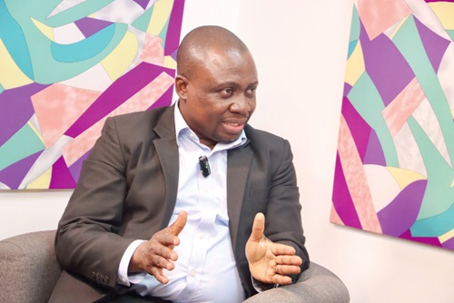  Abeiku Gyan-Quansah — Senior Partner, PwC Ghana, explaining a point 