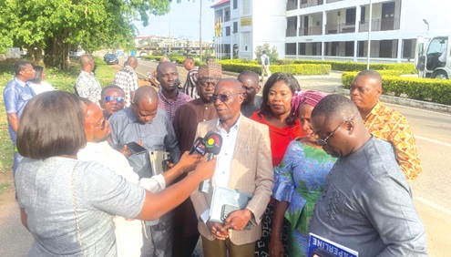 Peter Kwasi Nortsu-Kotoe, Chairman of the Parliamentary Select Committee on Education, speaking to the media after the tour