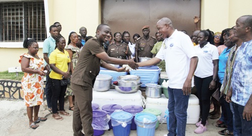 Assistant Superintendent of Prisons Courage Atsu (left), Volta Regional Chaplain of the Ghana Prisons Service, receiving the food items from Prophet Bright Brampah, General Overseer of Christ Power for All Nations Ministry, while some prison officers and members of the ministry look on Assistant Superintendent of Prisons Courage Atsu (left), Volta Regional Chaplain of the Ghana Prisons Service, receiving the food items from Prophet Bright Brampah, General Overseer of Christ Power for All Nations Ministry, while some prison officers and members of the ministry look on