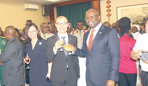Dr Edward Omane Boamah (right), Minister of Defence,  in a toast with Tong Defa, Chinese Ambassador to Ghana