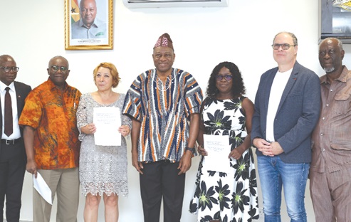 Dr Abdul Rashid Pelpuo (middle), Minister of Labour, Jobs and Employment, with Martha Akoibea Anang (3rd from right), Bjorn Mulle (2nd from right), project manager, BFW, Reverend Albert Kwabi (2nd from left) and some executives after the signing ceremony. Picture: BENEDICT OBUOBI