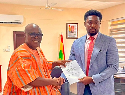 Dr Eric Kofi Adzroe (left), Director-General of Ghana TVET Service, and Gerald Acheampong, CEO of TSI, exchanging documents after signing the agreement 