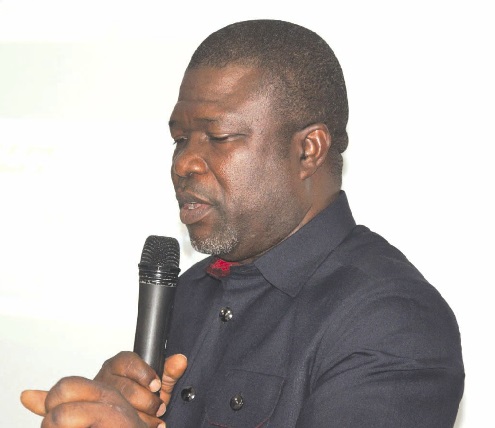 James Gunu (inset), Volta Regional Minister, addressing the laboratory managers at the meeting