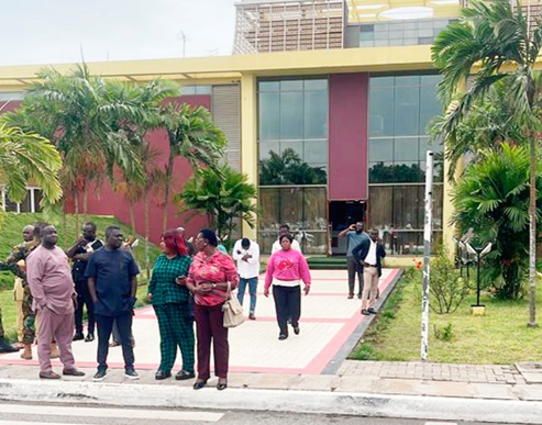 Staff at the Jubilee House seen outside their offices as the disaster was announced by Julius Debrah, the Chief of Staff