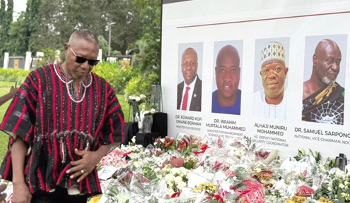 Dr Clement Apaak, Deputy Minister of Education, paying his last respects to the deceased Dr Clement Apaak, Deputy Minister of Education, paying his last respects to the deceased