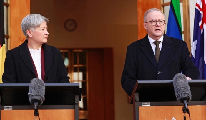 Australia's Foreign Minister Penny Wong (L) listens to Australia's Prime Minister Anthony Albanese as he speaks during a press conference in Canberra, Australia on Aug. 11, 2025. Hilary Wardhaugh/AFP via Getty Images