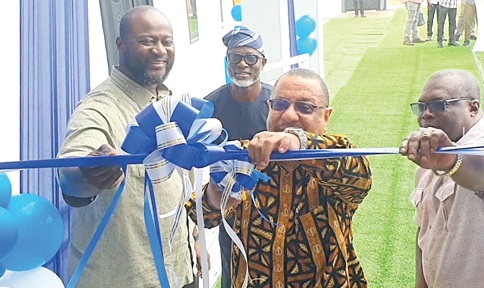 A view of the newly constructed Seasons Court. INSET:  Ralph Roland (middle), Board Chair, State Housing Company,  cutting the ribbon to officially inaugurate the Seasons Court. With him is John Sheriff Bawah (left), Managing Director, State Housing Company Limited, and Samuel Atukwei Quaye (right), Deputy MD, State Housing Company Limited. Picture: ERNEST KODZI