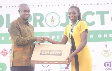 James Agyenim-Boateng(left), Managing Director of SIC Insurance PLC, presenting a laptop to Eva Yankey, BSC Dietetics, KNUST, one of the beneficiaries of the 2025 SONSOL Project.Picture: EMMANUEL BAAH