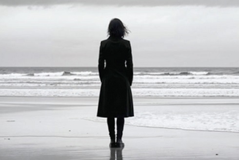 Silhouette grieving woman