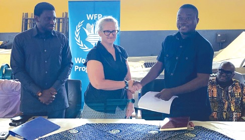 Nana Kwabena Adjei-Anafo (right), the Deputy Chief Executive of Gratis Foundation, in a handshake with Nicole Carn (middle), the Deputy Country Director of WFP Ghana, as Steven Odarteifio (left), Head of Food Systems at the WFP Ghana, looks on Nana Kwabena Adjei-Anafo (right), the Deputy Chief Executive of Gratis Foundation, in a handshake with Nicole Carn (middle), the Deputy Country Director of WFP Ghana, as Steven Odarteifio (left), Head of Food Systems at the WFP Ghana, looks on