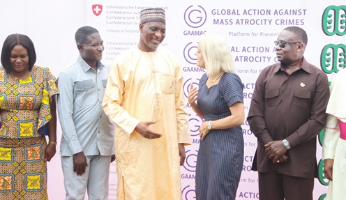 Mohammed Mubarak (2nd from left), Minister for the  Interior, interacting with Simone Giger (2nd from right), Swiss Ambassador to Ghana, after the launch. With them are Dr George Amoh (left), Executive Secretary of the National Peace Council, and James Gyakye Quayson (right), Deputy Minister of Foreign Affairs. Picture: ELVIS NII NOI DOWUONA 