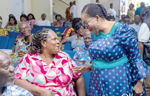 Some retired ministers of the Assemblies of God Church going through the sceeing exercise. INSET: First Lady Lordina Mahama (right) in a chat with one of the retired ministers of the Assemblies of God Church
