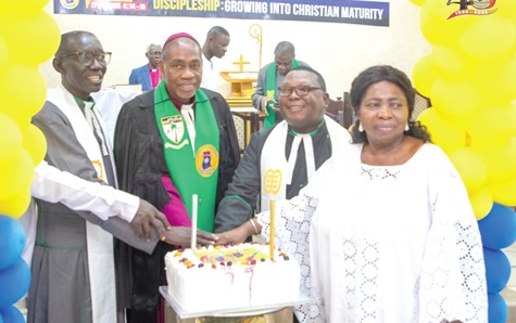 Right Rev. Dr Samuel Nii Nmai Ollennu (2nd from left), Methodis Bishop of Accra, being assisted by other ministers of the Methodist Church Ghana to cut the anniversary cake Right Rev. Dr Samuel Nii Nmai Ollennu (2nd from left), Methodis Bishop of Accra, being assisted by other ministers of the Methodist Church Ghana to cut the anniversary cake