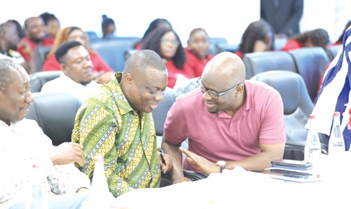 Hamza Suhuyini, (right), Member, NDC Communications Team, engaging with Mussa Dankwah, Executive Director, Global InfoAnalytics, during the UniMAC's Department of Marketing Political Marketing forum