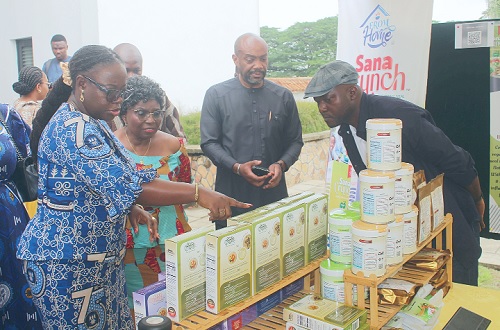 Prof. Nana Aba Appiah Amfo (left), Vice-Chancellor, UG, observing some products at an exhibition stand. With her are Pierre Brunache (2nd from right), Director of 'Nkabom' Secretariat, and Anna Lartey (2nd from left), Professor at the Department of Nutrition, UG.Picture: ERNEST KODZI Prof. Nana Aba Appiah Amfo (left), Vice-Chancellor, UG, observing some products at an exhibition stand. With her are Pierre Brunache (2nd from right), Director of 'Nkabom' Secretariat, and Anna Lartey (2nd from left), Professor at the Department of Nutrition, UG.Picture: ERNEST KODZI