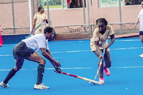 • Berlinger Asare of Legon Knights (left) contests with Reformers Ladies’ Felicia Affum