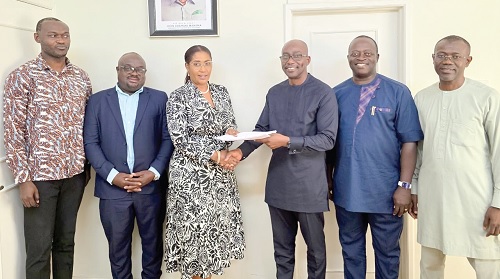 Kwame Ntow Amoah (3rd from right), acting Chief Executive Officer of GNPC, exchanging the documents with Emeafa Hardcastle, CEO of Petroleum Commission, after signing the agreement