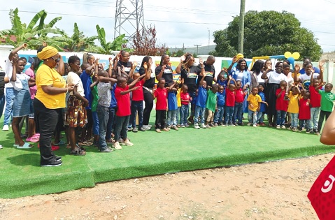 Guests, staff of the home and some of the children at the Porter’s Village at the playground after the event. 