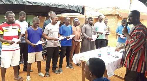 Emmanuel Kwame Frimpong (right), Tano South MCE, swearing in the Brosankro Zonal Council members Emmanuel Kwame Frimpong (right), Tano South MCE, swearing in the Brosankro Zonal Council members