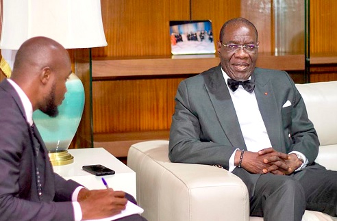 Assiélou Felix Tanon (right), Ivorian Ambassador to Ghana, speaking during the interview with Pacome Emmanuel Damalie (left), the Daily Graphic Reporter