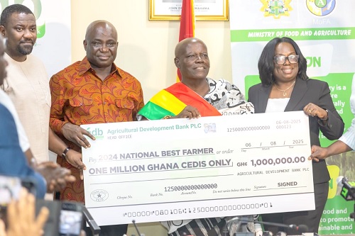 Eric Opoku (2nd from left), Minister of Food and Agriculture, and his Deputy, John Dumelo, together with Sylvia Nyanteh (right), Deputy MD, Operations, ADB , presenting the cheque to Nana Achiaw Brempong (2nd from right), 2024 National Best Farmer