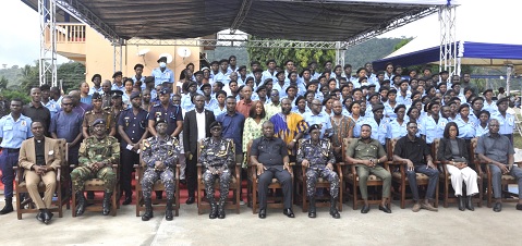 James Gunu (seated middle), Volta Regional Minister; some officers of the security agencies, other dignitaries and some of the community protection assistants