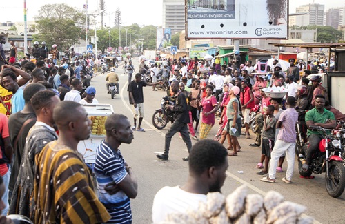Scores of Shatta Wale fans at the EOCO head office. Pictures: CALEB VANDERPUYE