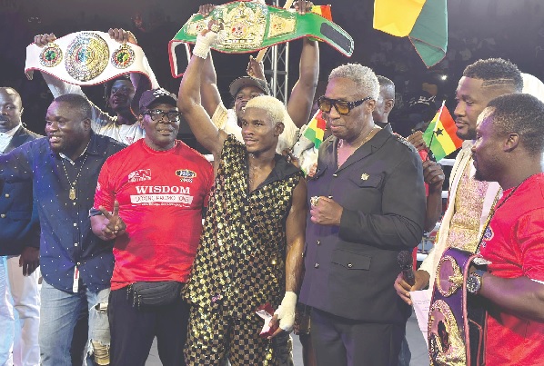 • Victorious Theophilus Allotey celebrates with promoter Dave Bishop (2nd from right) and veteran trainer Kwasi Ofori Asare (2nd from left) after his triumph over Martin Kouassi Klaklevi • Victorious Theophilus Allotey celebrates with promoter Dave Bishop (2nd from right) and veteran trainer Kwasi Ofori Asare (2nd from left) after his triumph over Martin Kouassi Klaklevi