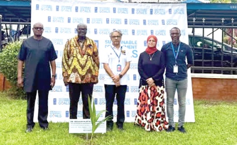 Niloy Banerjee (middle), UNDP Resident Representative, Shaima Hussein (2nd from right), Deputy UNDP Resident Rep, Prosper Bani (left) and Dr Peter Dery (2nd from left), Environmental Director, Ministry of Environment, Science and Technology, after they had planted the trees Niloy Banerjee (middle), UNDP Resident Representative, Shaima Hussein (2nd from right), Deputy UNDP Resident Rep, Prosper Bani (left) and Dr Peter Dery (2nd from left), Environmental Director, Ministry of Environment, Science and Technology, after they had planted the trees