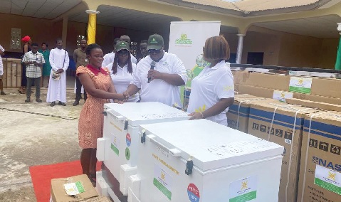 Dr Kojo Punpuni Asante presenting some of the medical equipment to a representative of one of the CHPS compounds at the ceremony