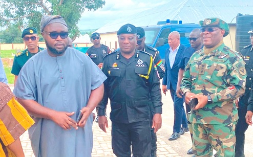 Salisu Be-Awuribe (left), Savannah Regional Minister, conducting COP Christian Tetteh Yohuno, IGP, and his team around