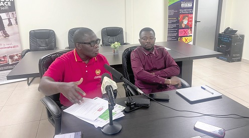 Dr Kwabena Nyarko Otoo (left ), Deputy  Secretary-General  of TUC, speaking at the media launch. With him is Dr Hod Anyigba, Chief Economist of ITUC-Africa