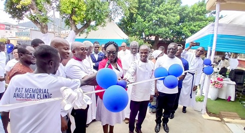 Rt Rev. Felix Odei Annancy (middle), Bishop of the Koforidua Diocese of the Anglican Church, being assisted by Dr Samuel Bortier Borlabi (2nd from left), Deputy Director of the Eastern Regional Health Directorate, and Eunice Abuaku (3rd from right), New Juaben South Municipal Health Director, to inaugurate the new clinic in Koforidua