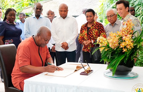 President John Mahama signing a visitors' book at the National Orchid Garden in Singapore President John Mahama signing a visitors' book at the National Orchid Garden in Singapore